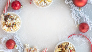 Marigold Popcorn Holiday popcorn flavors on white snowy background 